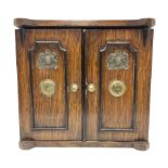 Victorian oak smoker's cabinet / cigar and cigarette box modelled in the form of a two door safe