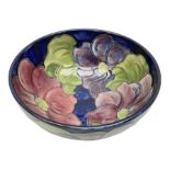 Moorcroft Clematis pattern footed bowl on a blue ground