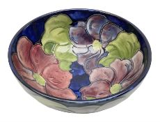 Moorcroft Clematis pattern footed bowl on a blue ground