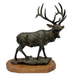 Bronzed cast metal figure of a stag upon a naturalistic base