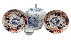 Pair of scalloped plates decorated in the Imari palette decorated with central circular motif of bir