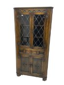 Jacobean design oak corner display cabinet