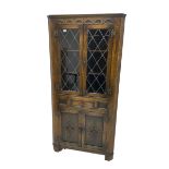 Jacobean design oak corner display cabinet