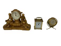 Two quartz battery operated clocks and a Smiths spring wound globe clock.