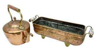 Copper planter of rectangular form with brass feet and twin handles