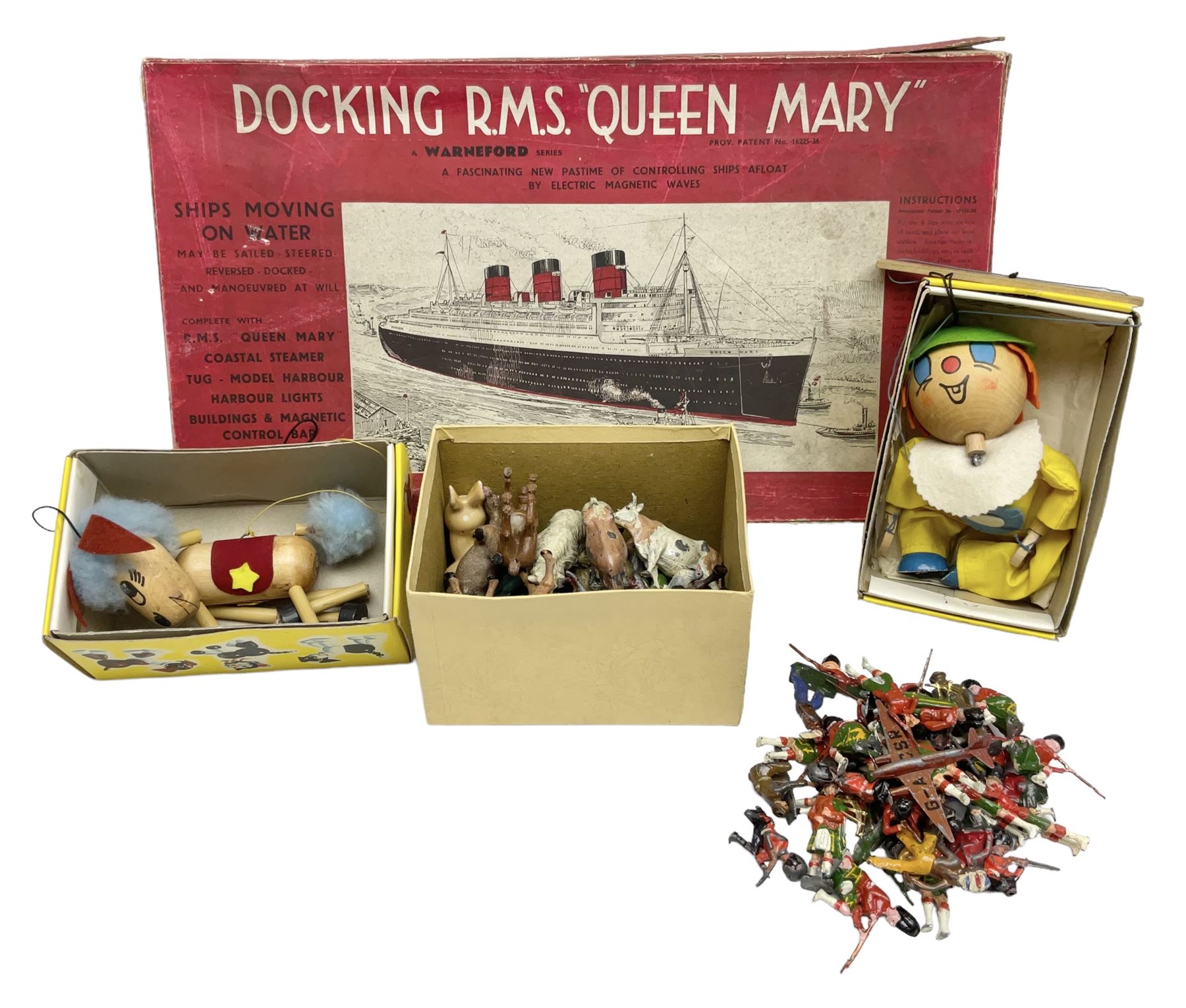 Vintage toys comprising 'Docking RMS Queen Mary' game