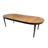 Mid-20th century walnut and elm oval extending dining table with two additional leaves