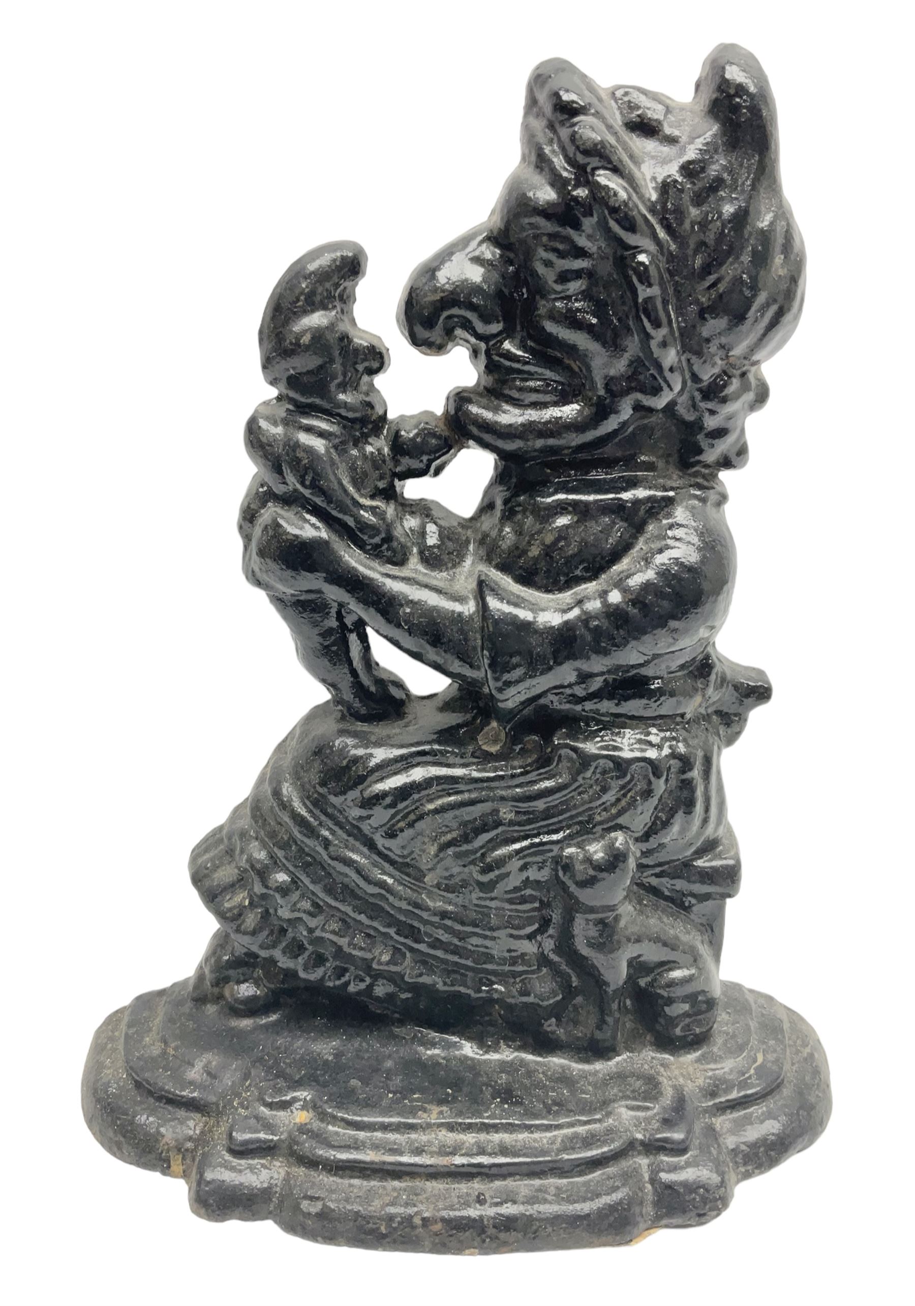 Cast iron moulded doorstop in the form of Punch and Judy