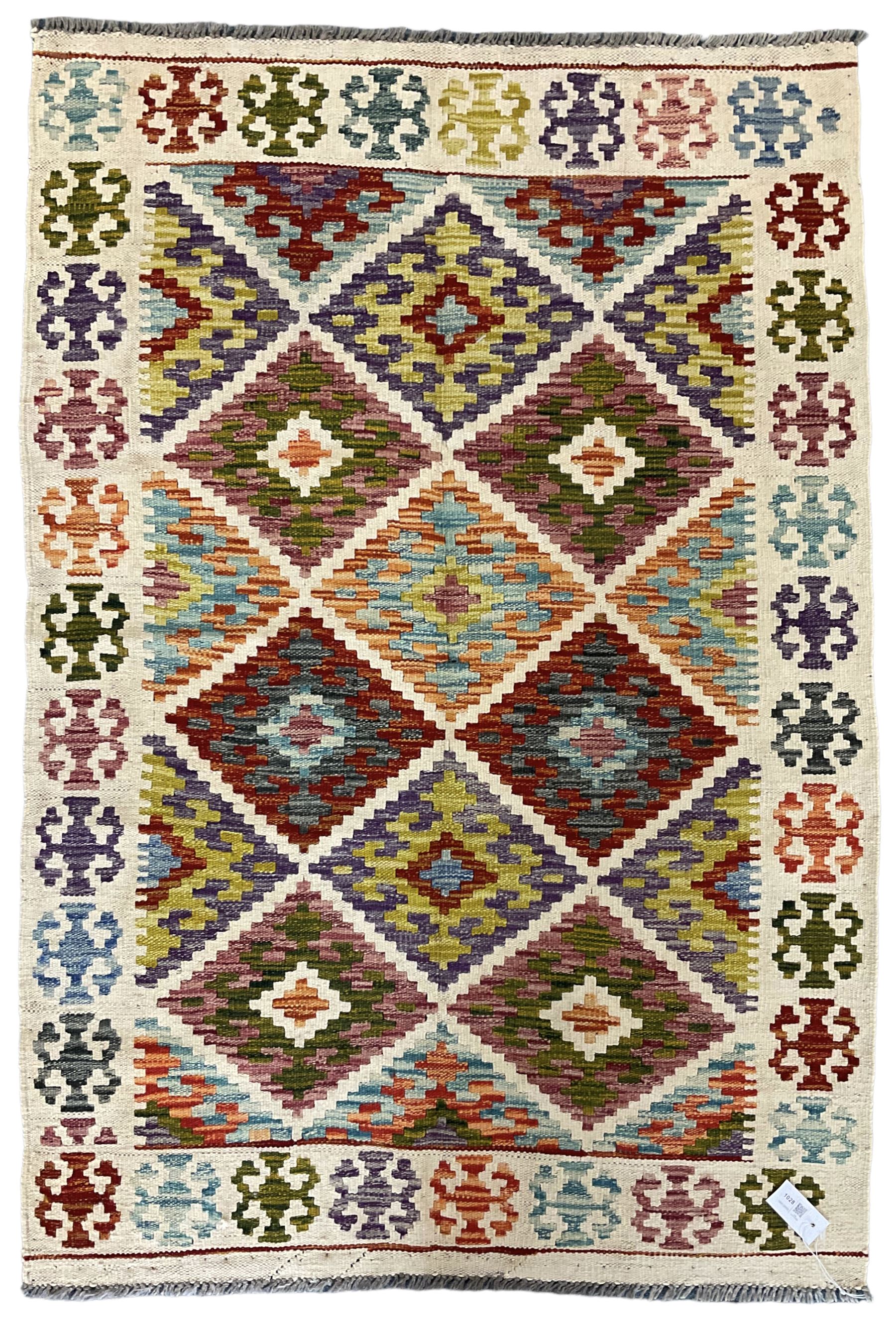Chobi Kilim ivory and multi-colour rug decorated with stepped geometric lozenges and repeating borde