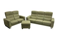 Ekornes Stressless - three seat reclining sofa upholstered in pale green fabric (198cm x 82cm x 100c