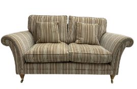 Parker Knoll - 'Burghley' two seat sofa upholstered in pale stripe fabric