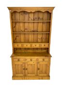 Pine kitchen dresser fitted with three tier plate rack and four spice drawers