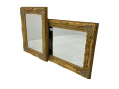 Pair bevelled edge wall mirrors in swept gilt frames decorated with ornate cartouches