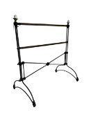 Early 20th century wrought metal and brass towel rail