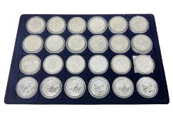 Twenty-four Queen Elizabeth II Britannia one ounce fine silver two pound coins