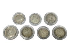 Seven silver sixpence coins