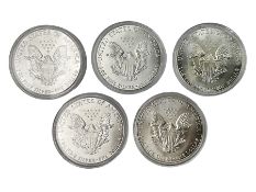 Five United States of America 1oz fine silver one dollar coins