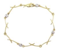 9ct gold bezel set diamond crossover link bracelet