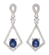 Pair of 18ct white gold oval sapphire and diamond kite shaped
