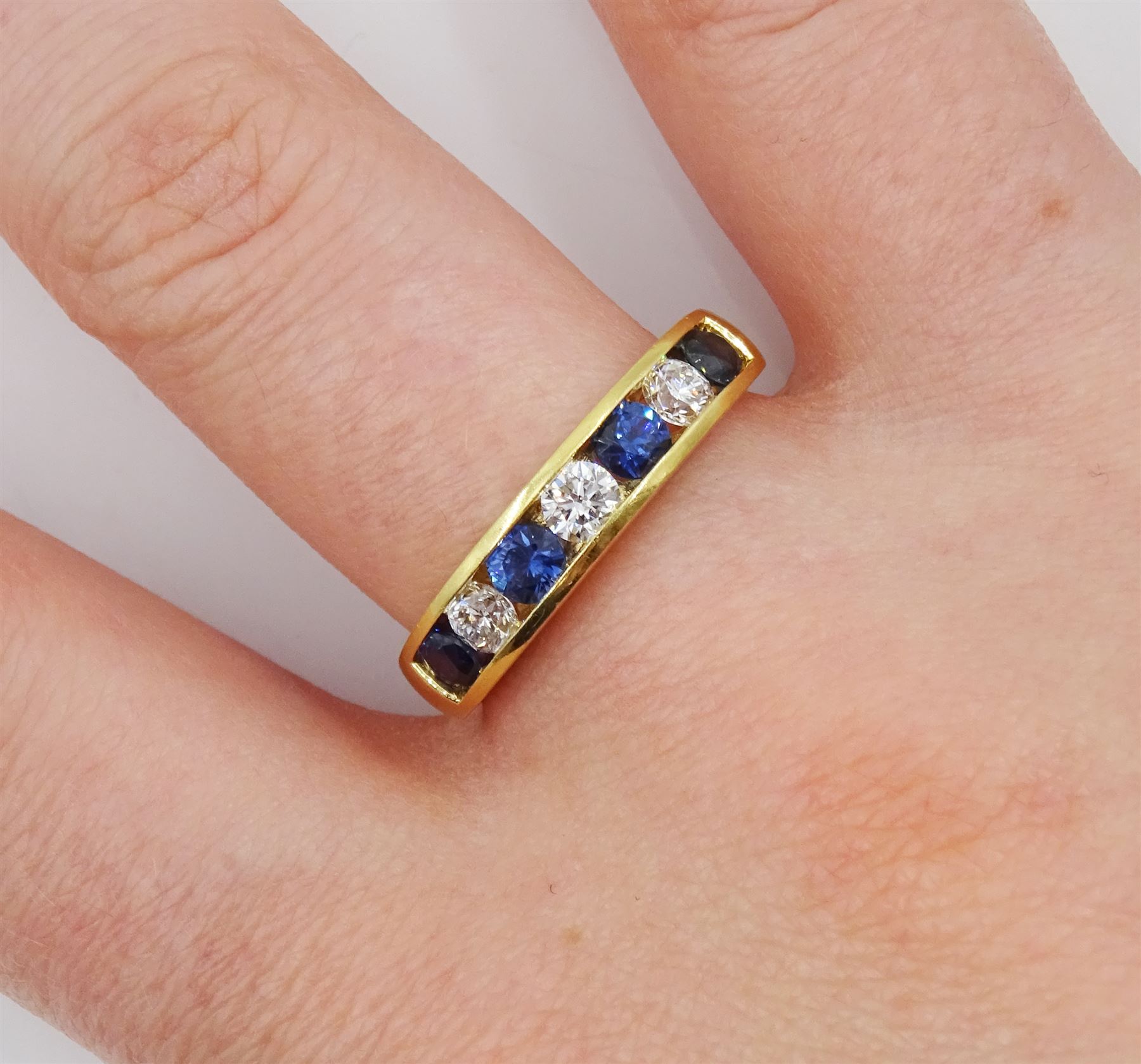 18ct gold channel set seven stone round brilliant cut diamond and round sapphire ring - Image 2 of 4