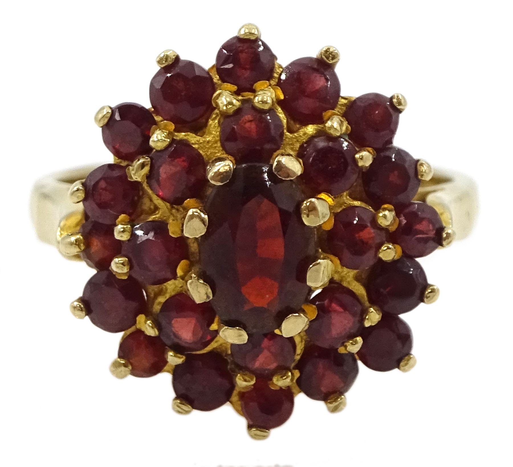 Gold oval and round garnet cluster ring