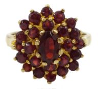 Gold oval and round garnet cluster ring