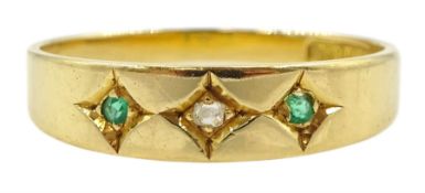 Early 20th century gold three stone gypsy set emerald and diamond ring