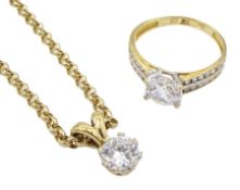 Gold single stone cubic zirconia pendant necklace and a gold cubic zirconia dress ring