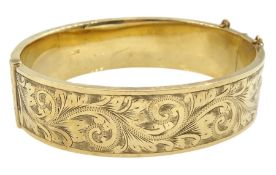 9ct gold hinged bangle with bright cut decoration by Henry Griffith & Sons Ltd