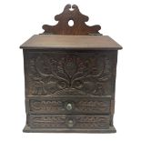 Late 19th century carved oak candle box with two drawers H39.5cm