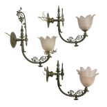 Set of three early 20th century brass wall lights with opaque pink glass shades in the form of flowe