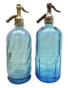Two blue glass soda syphons