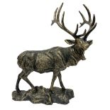 Bronzed cast metal figure of a stag upon a naturalistic base