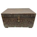 Mahogany chest covered with studded metal