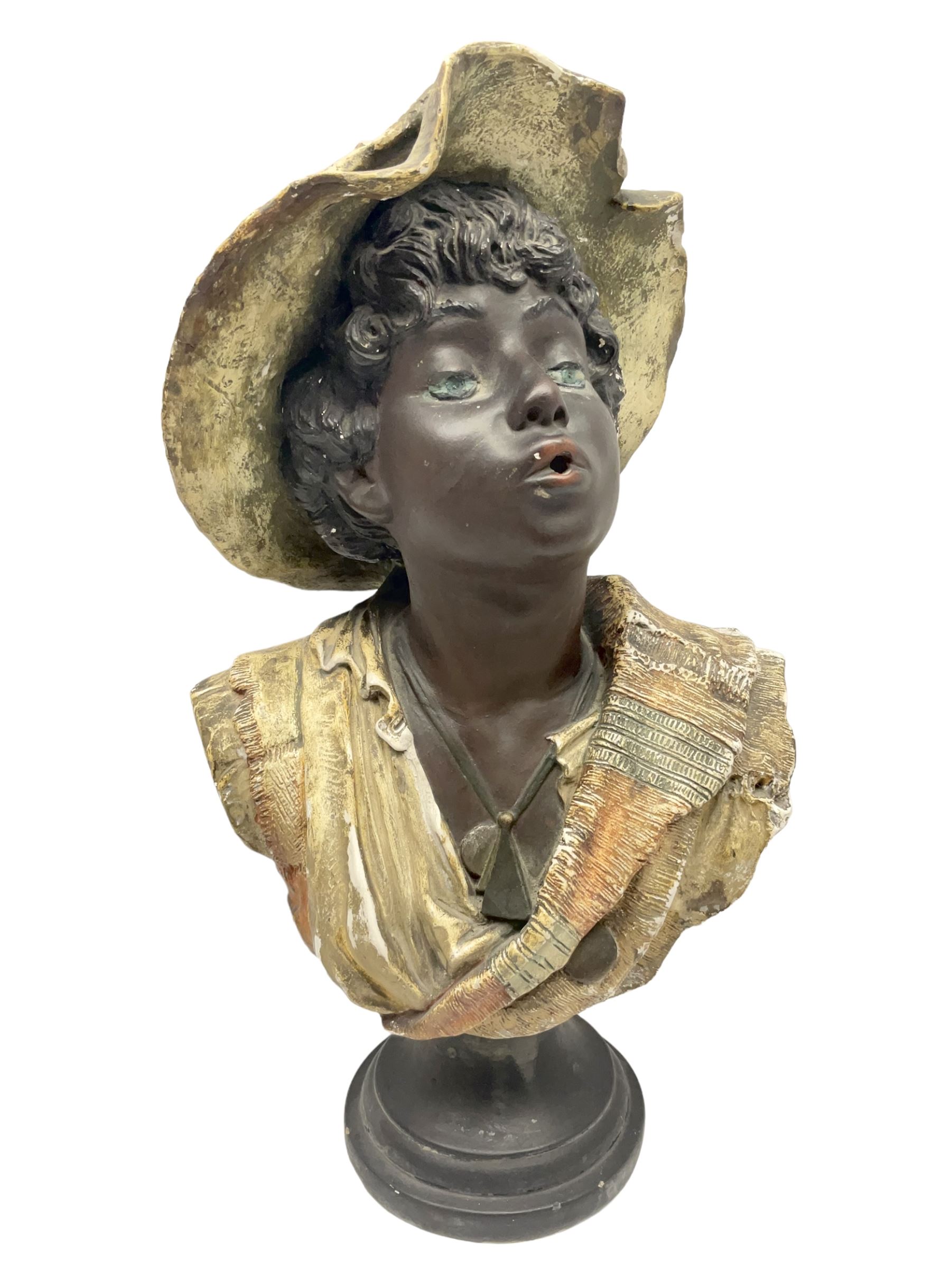 19th century plaster bust of a young boy wearing a hat