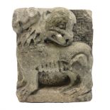 Carved stone relief in the form of a mythical creature
