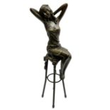 Art Deco style bronze modelled as a female figure seated upon a chair