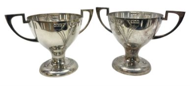 Pair of early 20th century WMF silver plated twin handled pedestal trophies