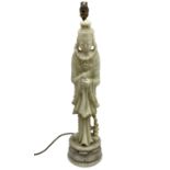 Carved soapstone lamp of Quan Yin on a lotus base