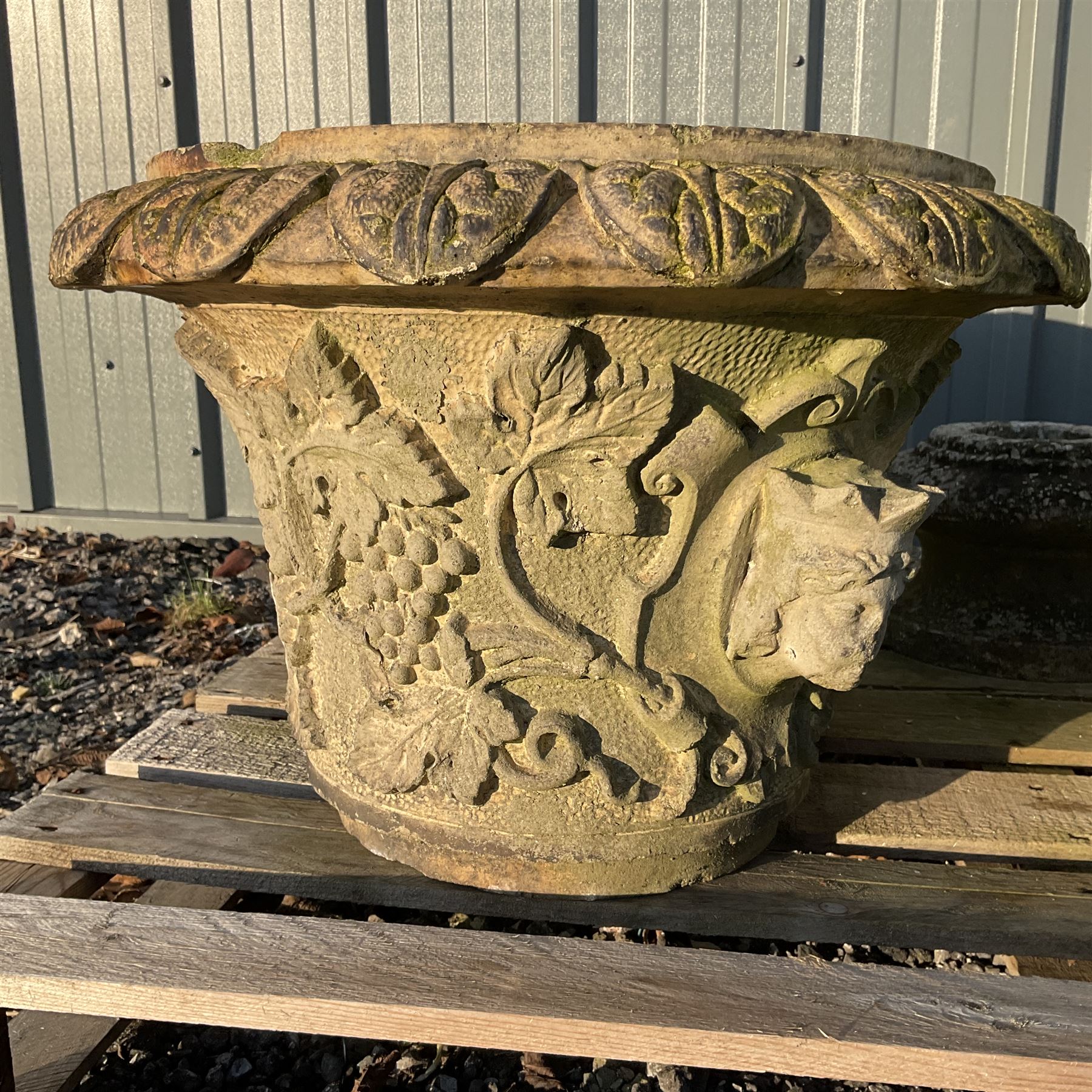 Cast stone animal with two garden urns decorated in grapes and faces with garden urn on plinth - Image 2 of 4