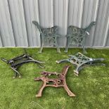 Four pairs of cast iron garden bench ends