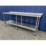Large stainless steel preparation table on wheels