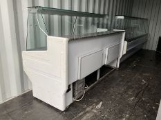 Two serve-over refrigerated display counters