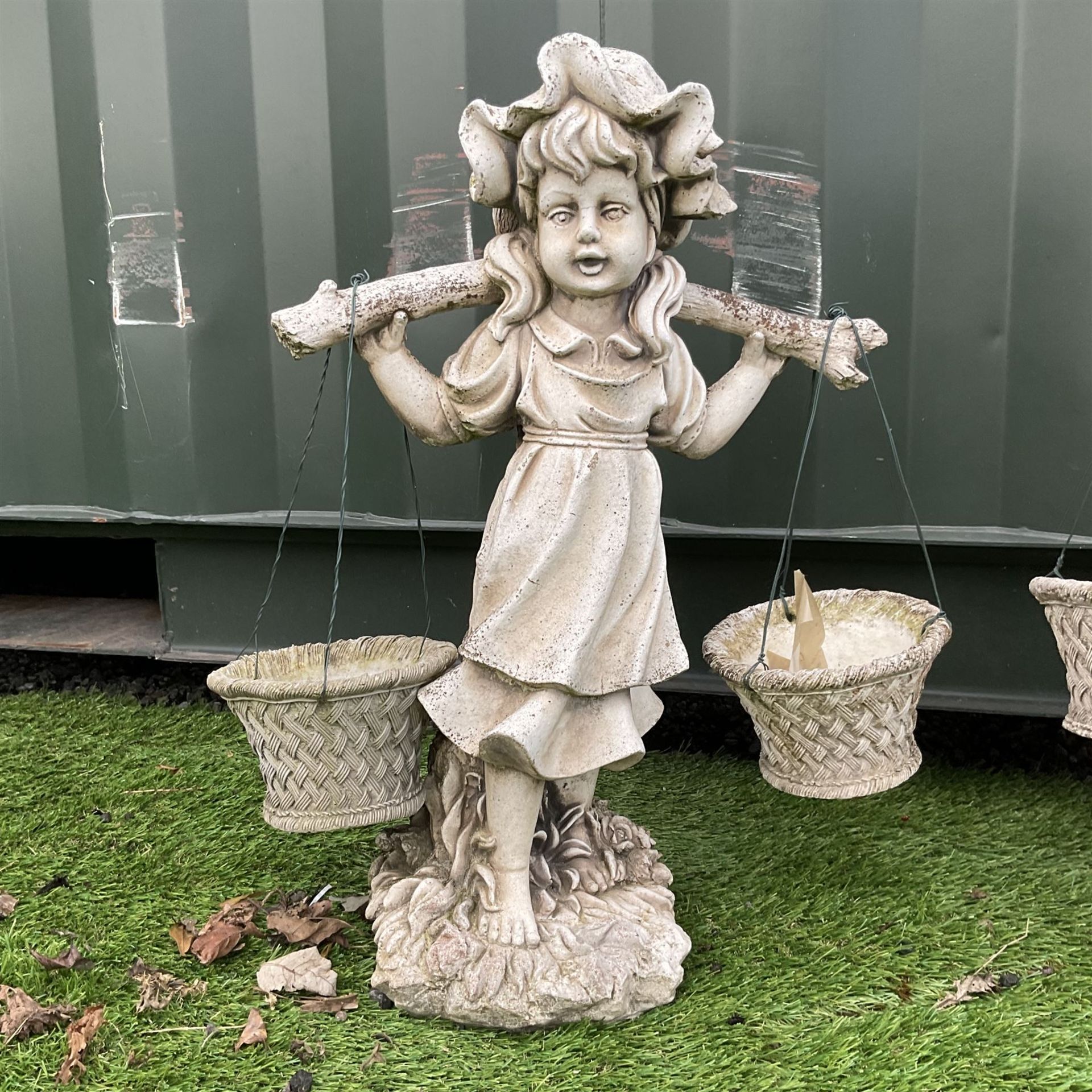 Pair of cast stone girl and boy garden ornaments - THIS LOT IS TO BE COLLECTED BY APPOINTMENT FROM D