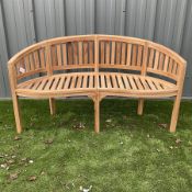 Solid teak serpentine garden bench