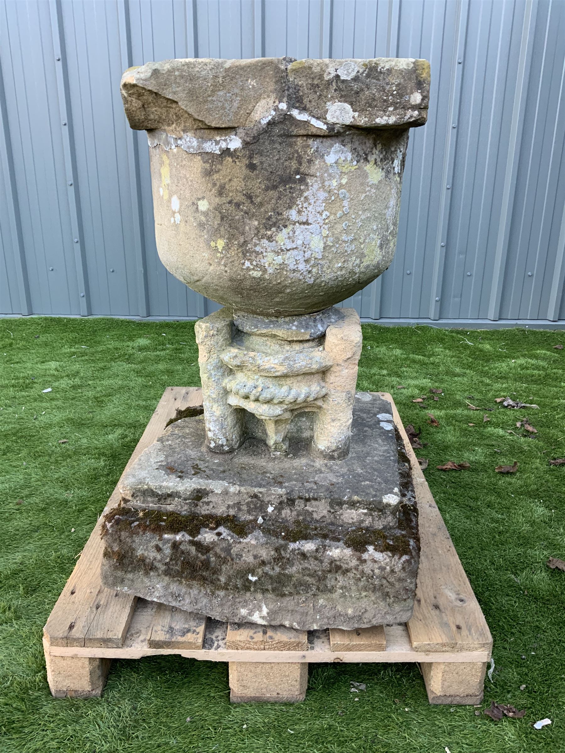 17/18th century stone font on square plinth