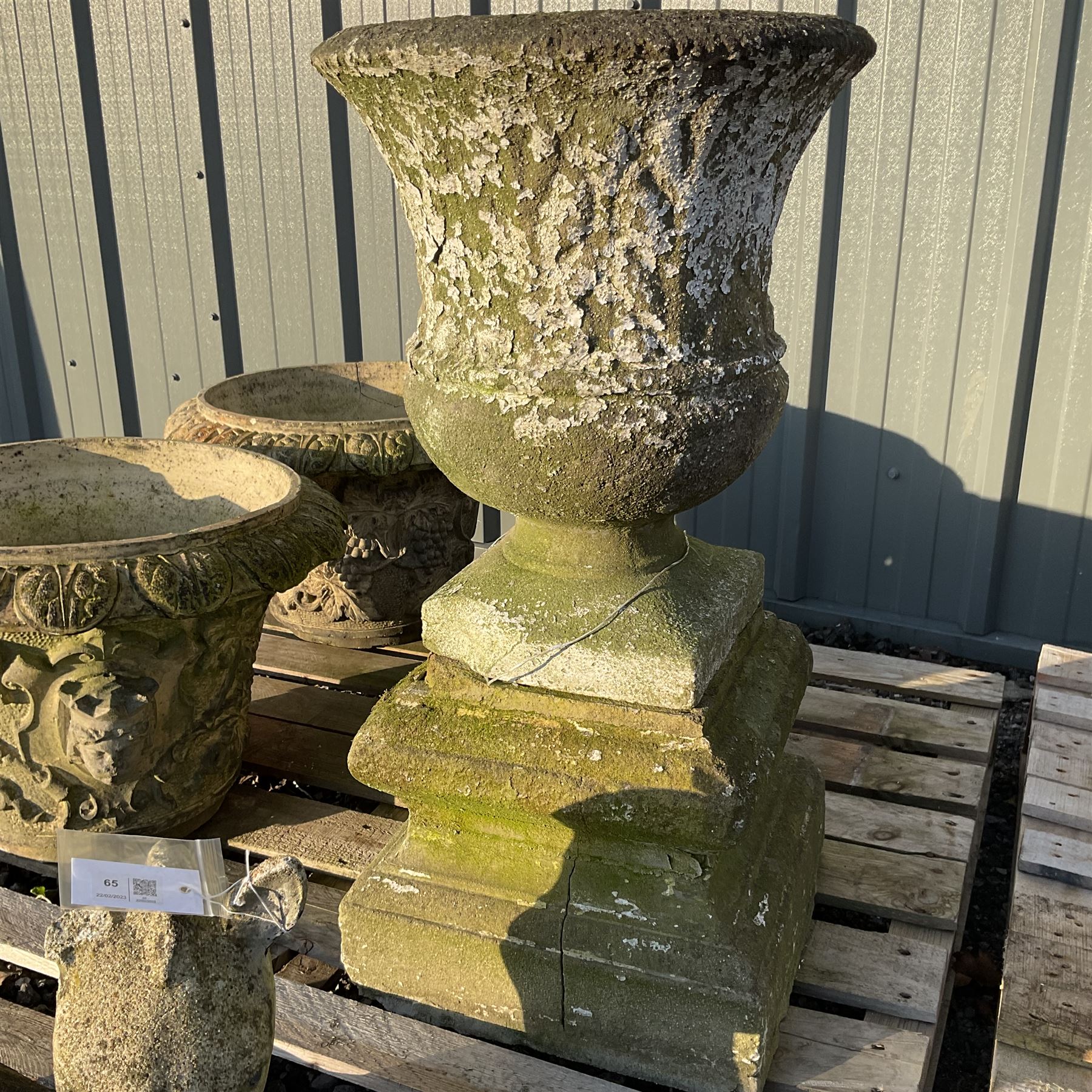 Cast stone animal with two garden urns decorated in grapes and faces with garden urn on plinth - Image 3 of 4