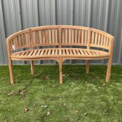 Solid teak serpentine garden bench