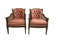 Pair stained beech framed bergere armchairs