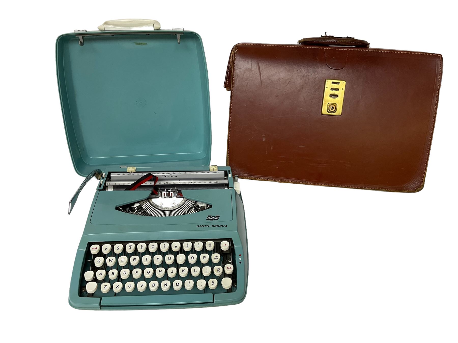 Blue Smith-Corona typewriter and leather bag